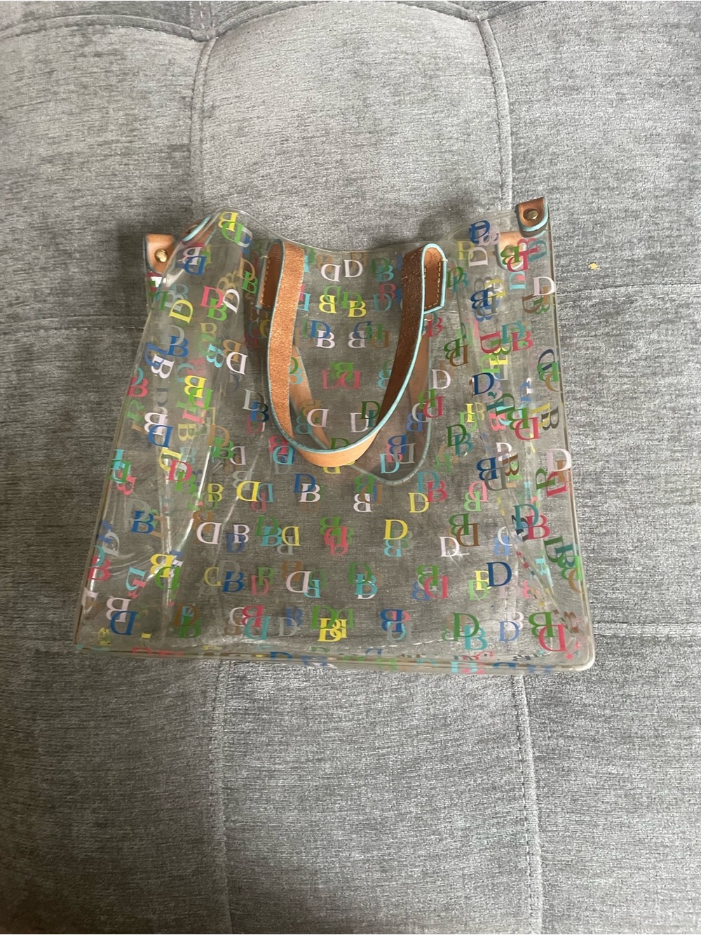 Dooney & Bourke Clear Tote with Multicolor Logo and Tan Handles